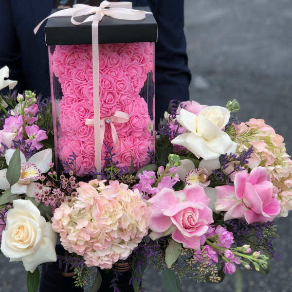 Pink rose box arrangement with white and blush flowers around it