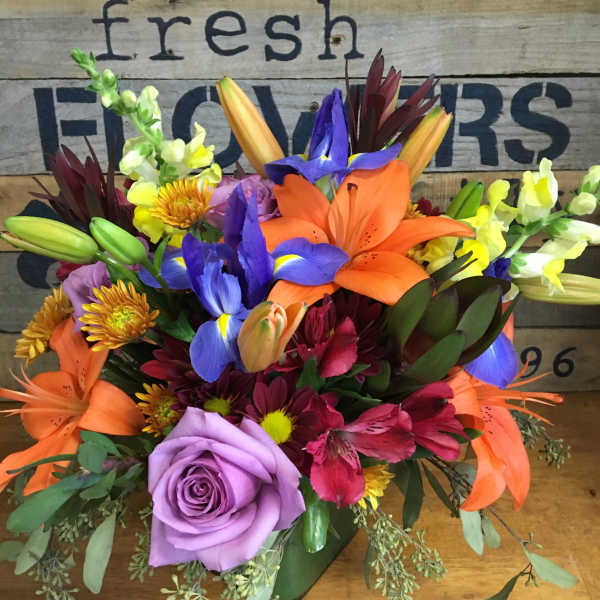 Colorful mixed bouquet with lilies, iris, roses, and snapdragons