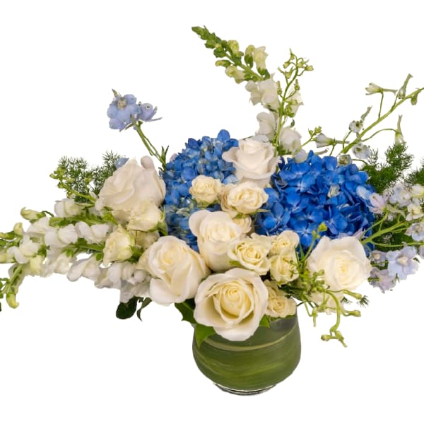 Blue hydrangeas and white roses in a green vase