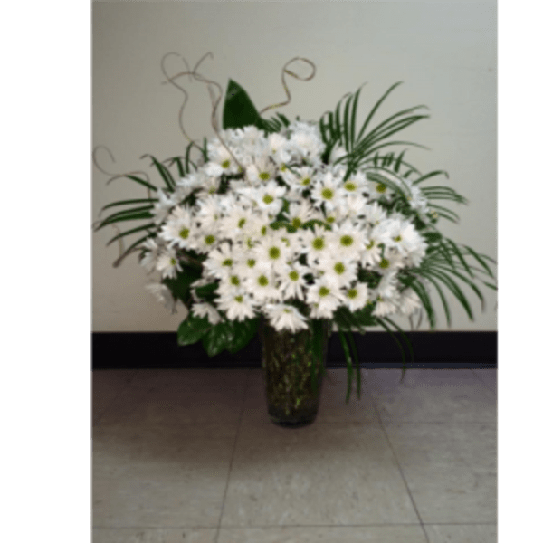 White daisy bouquet in a dark glass vase