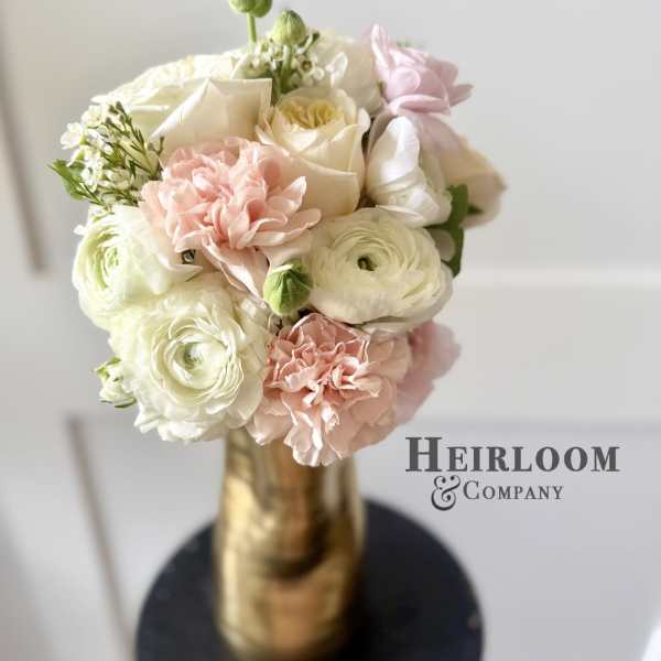 Blush and white bouquet in a gold vase