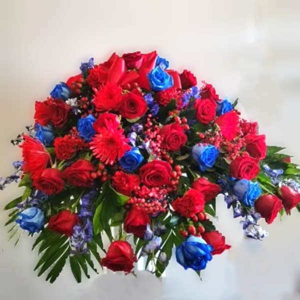 Large bouquet of red and blue roses with red accent flowers