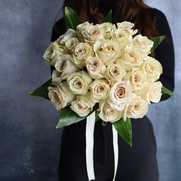 Bouquet of cream roses with white ribbon