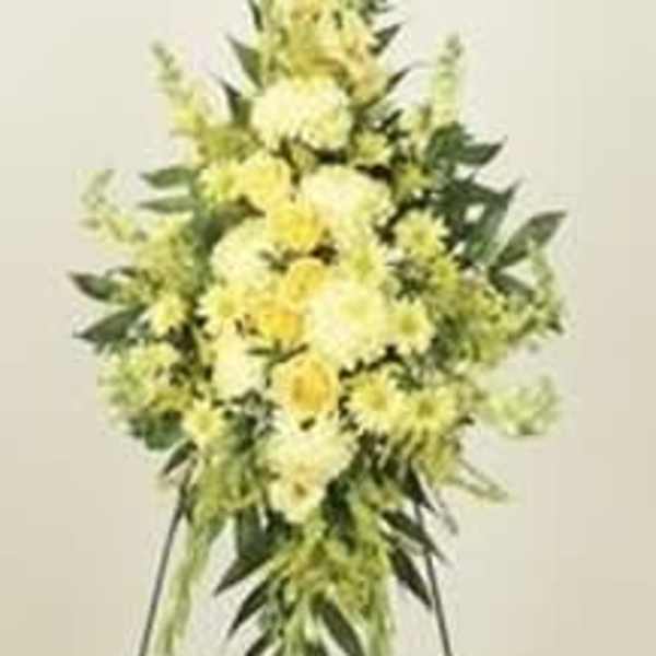 Tall yellow floral standing spray on an easel