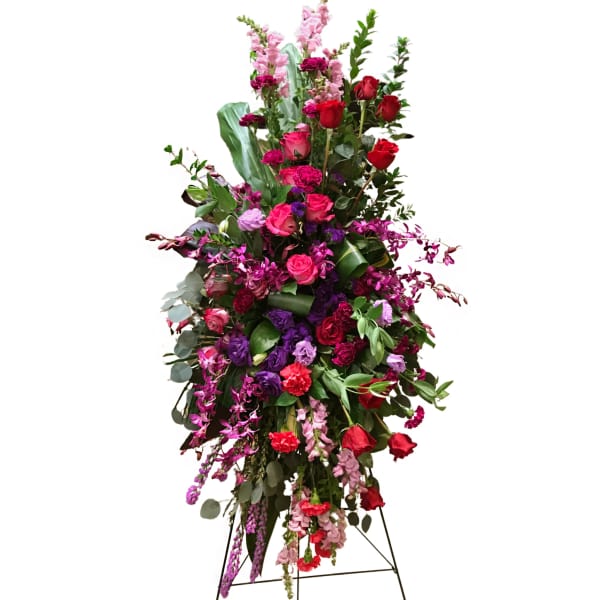 Tall standing floral spray with red, pink, and purple flowers