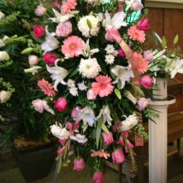 Large standing floral spray with pink and white flowers