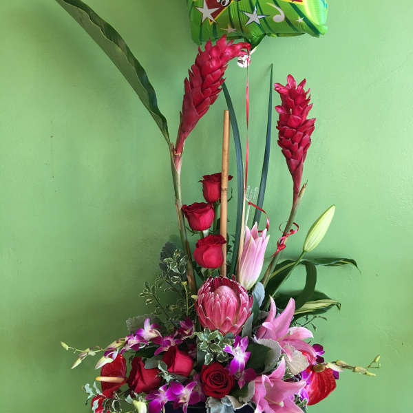 Tropical flower arrangement with roses and a "Get Well Soon" balloon