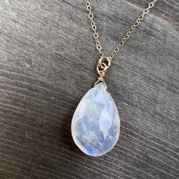 Teardrop pendant necklace with a pale blue stone on a chain