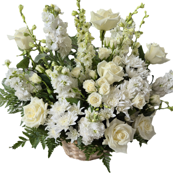 White roses and chrysanthemums arranged in a basket
