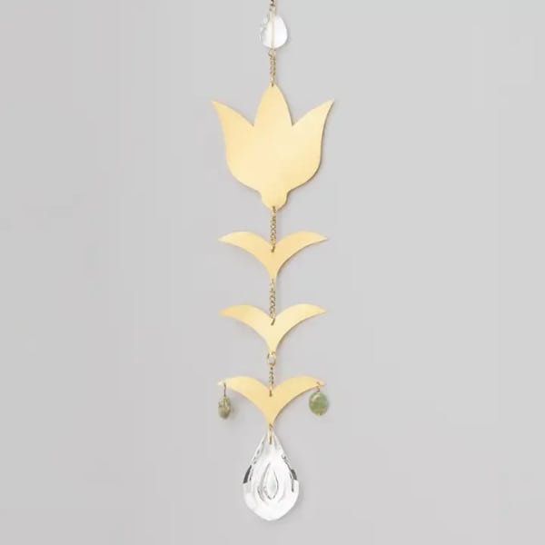 Hanging gold and silver decorative mobile with leaf-shaped pieces