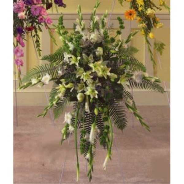 Tall floral standing spray with white lilies and greenery