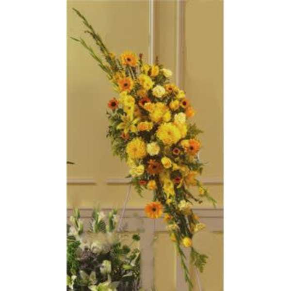 Tall yellow and orange floral spray on an easel