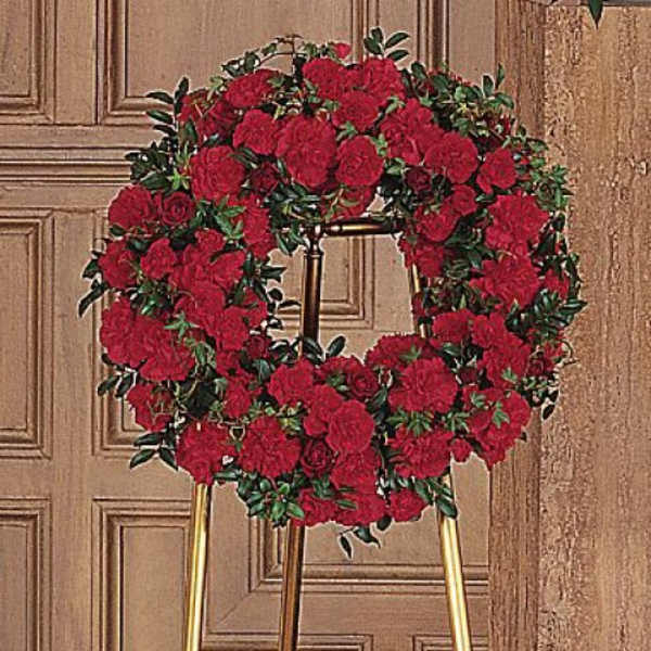 Red rose wreath on a stand