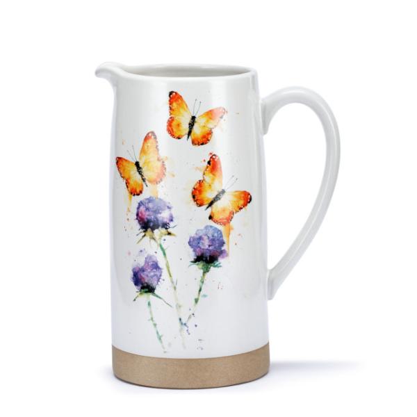 White ceramic pitcher with butterfly and purple flower design