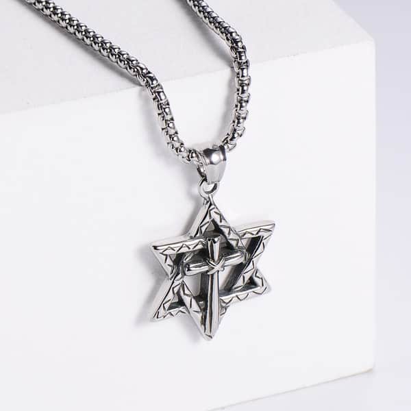 Silver necklace with a Star of David pendant on a white display card