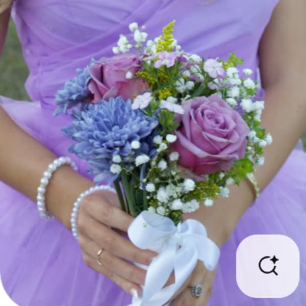 Bridal bouquet of lavender roses and blue flowers with white ribbon