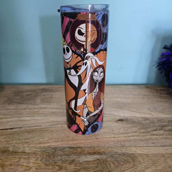 Halloween-themed insulated tumbler with cartoon characters