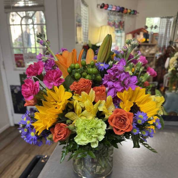 Colorful mixed bouquet in a clear glass vase