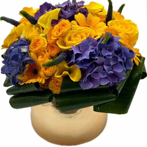 Bouquet of yellow and purple flowers in a gold vase
