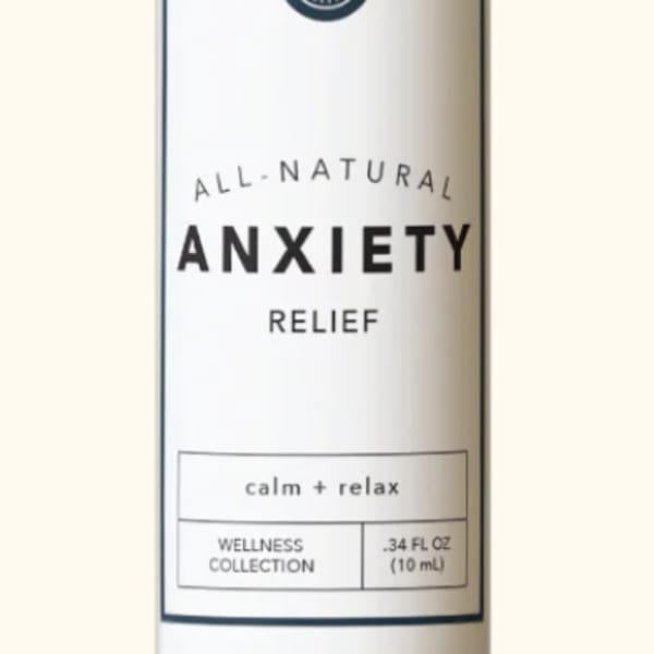Small amber bottle labeled anxiety relief with a black cap