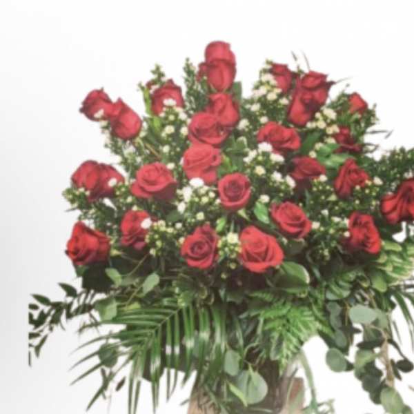 Large bouquet of red roses with mixed greenery
