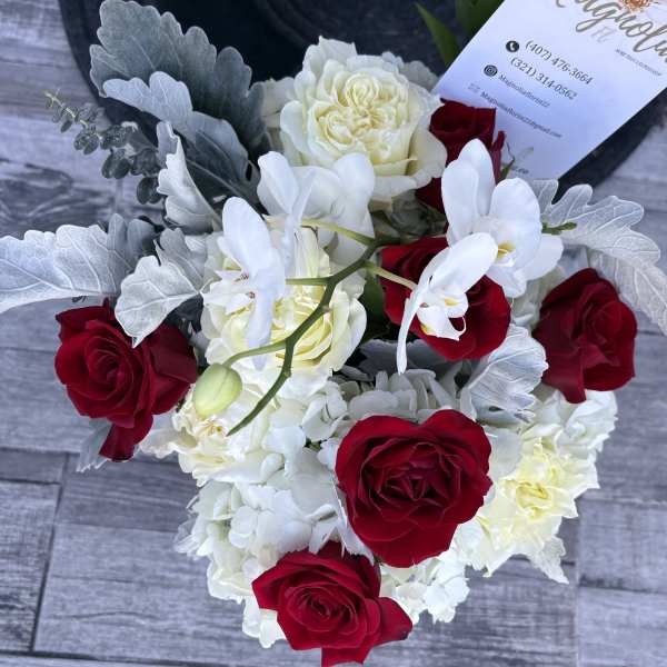 Bouquet of red and white roses with white orchids
