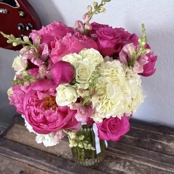 Pink and white flower bouquet in a glass vase