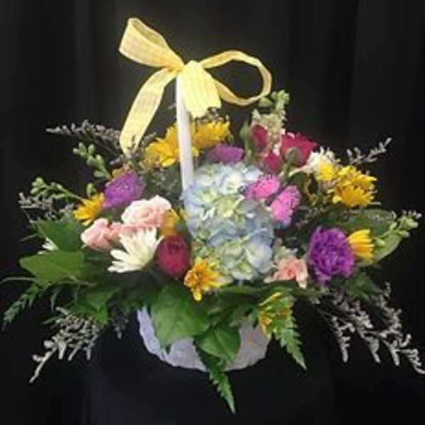 Colorful mixed flower basket with a yellow ribbon bow
