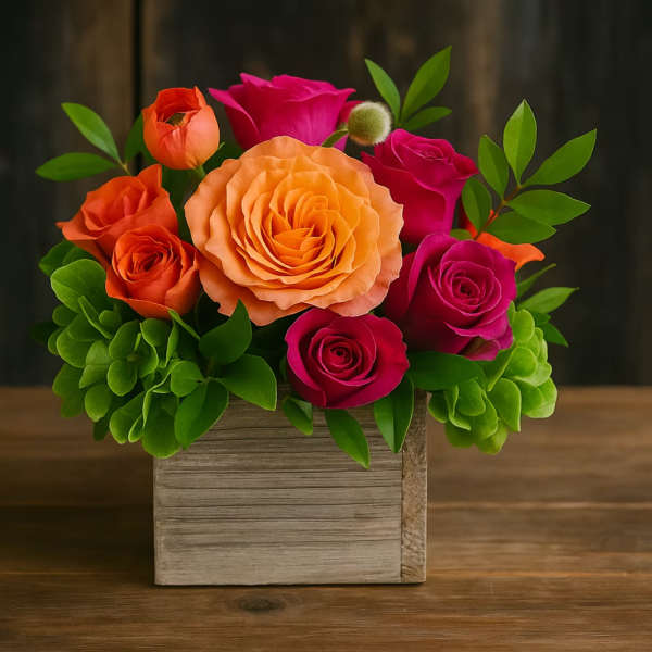 Colorful rose arrangement in a square wooden box