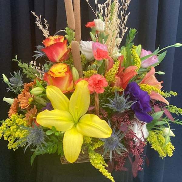 Colorful mixed bouquet with lilies, roses, and carnations