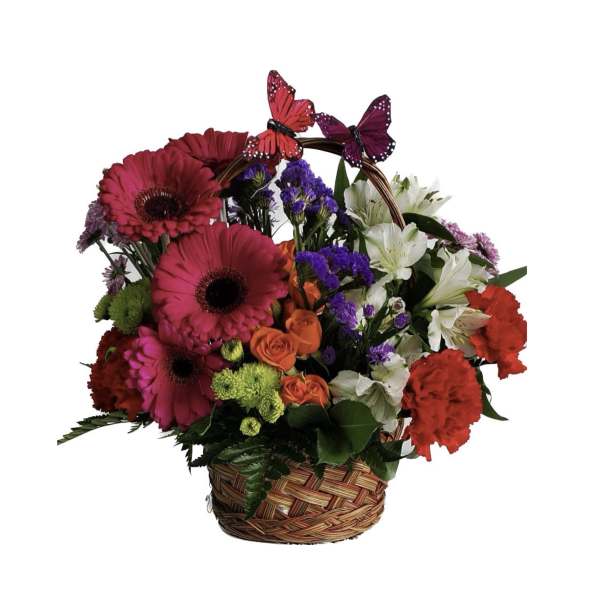 Basket arrangement of pink gerberas, orange roses, white lilies, and butterflies
