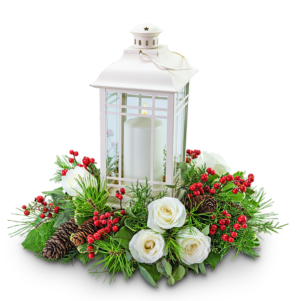 White lantern centerpiece with candles, roses, berries, and pinecones