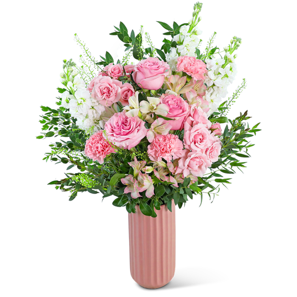 Pink roses and carnations in a tall pink vase