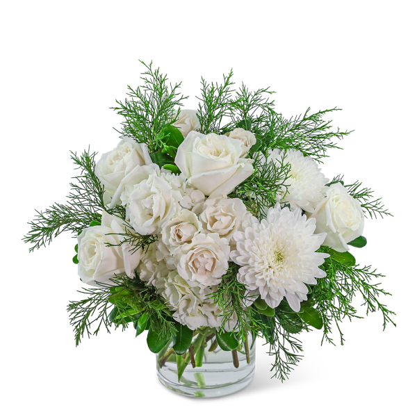 White roses and chrysanthemums in a clear glass vase