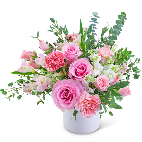 Pink roses and carnations in a white vase with mixed greenery