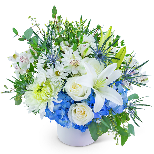 White lilies and roses with blue hydrangeas in a white vase