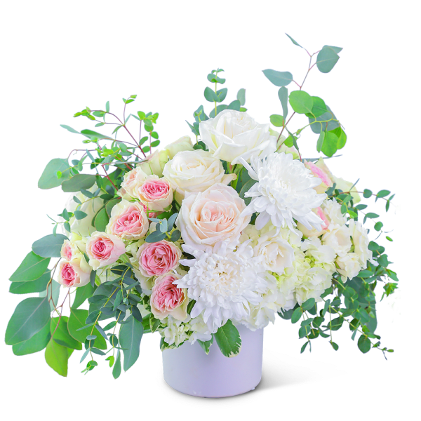 White and pink roses with white chrysanthemums in a white vase