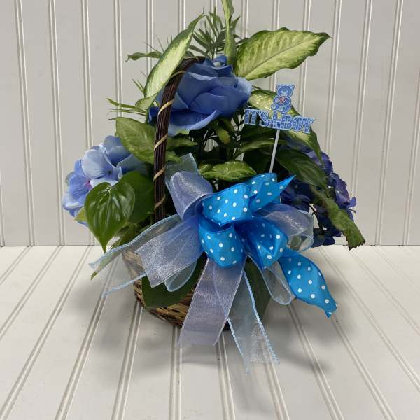 Blue floral basket with a baby boy pick and ribbon bow