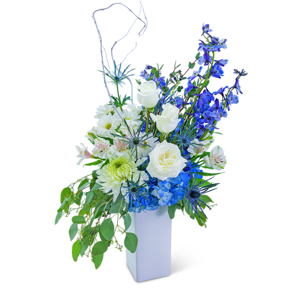 Blue and white floral arrangement in a white vase