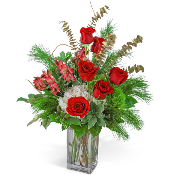 Red roses and white blooms in a clear glass vase with greenery