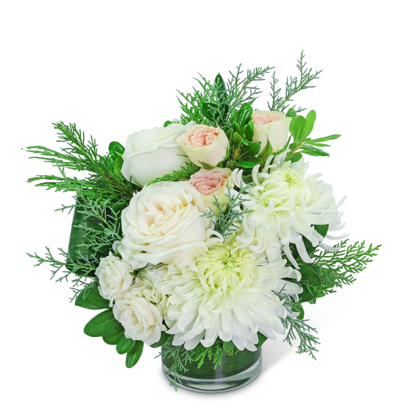White roses and chrysanthemums in a clear glass vase