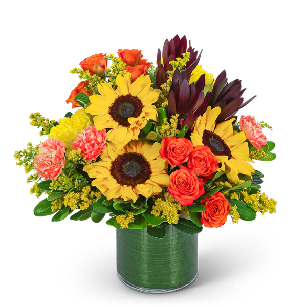 Bouquet of sunflowers, orange roses, and carnations in a green vase