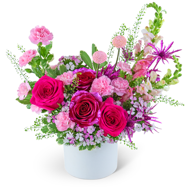 Pink and magenta rose arrangement in a white vase