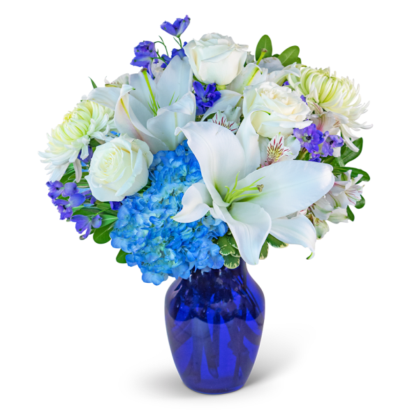 White lilies, roses, hydrangea, and purple flowers in a blue vase