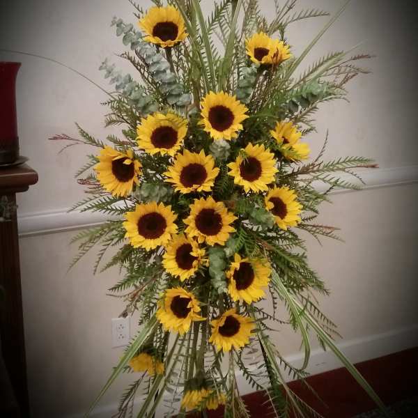 Tall sunflower arrangement with yellow blooms and mixed greenery