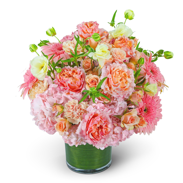 Pink and peach bouquet in a clear glass vase