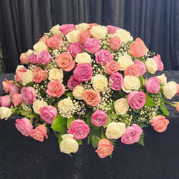 Large bouquet of pink, peach, and white roses