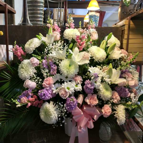 Large mixed bouquet with white lilies, chrysanthemums, and pink flowers