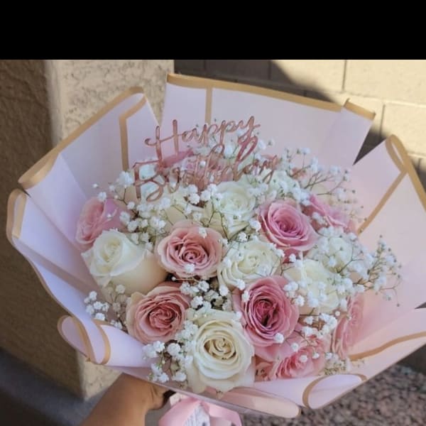 Pink and white rose bouquet with a Happy Birthday topper
