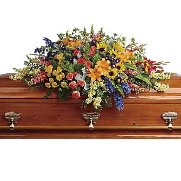 Colorful floral spray on a wooden casket